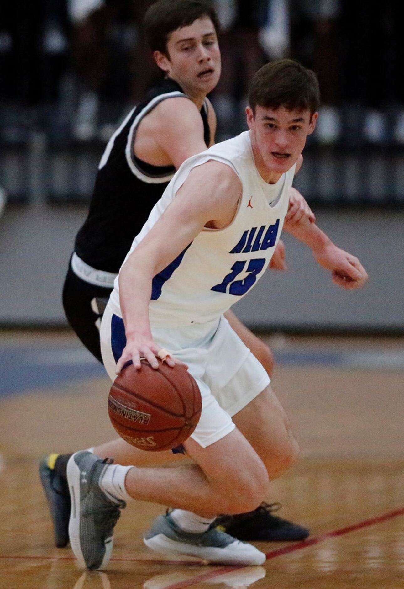 Allen High School's Ian Motta (13) steals the basketball from Denton Guyer High School's...