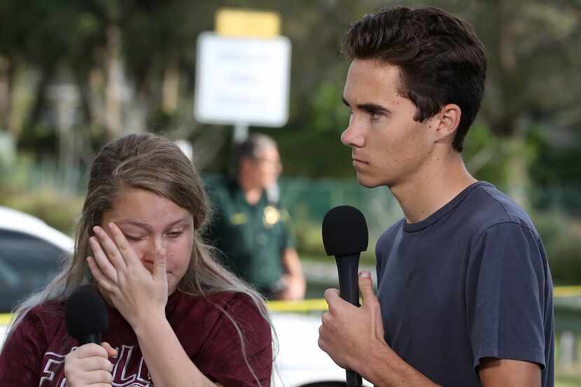 Students Kelsey Friend (L) and David Hogg recount their stories about yesterday's mass...