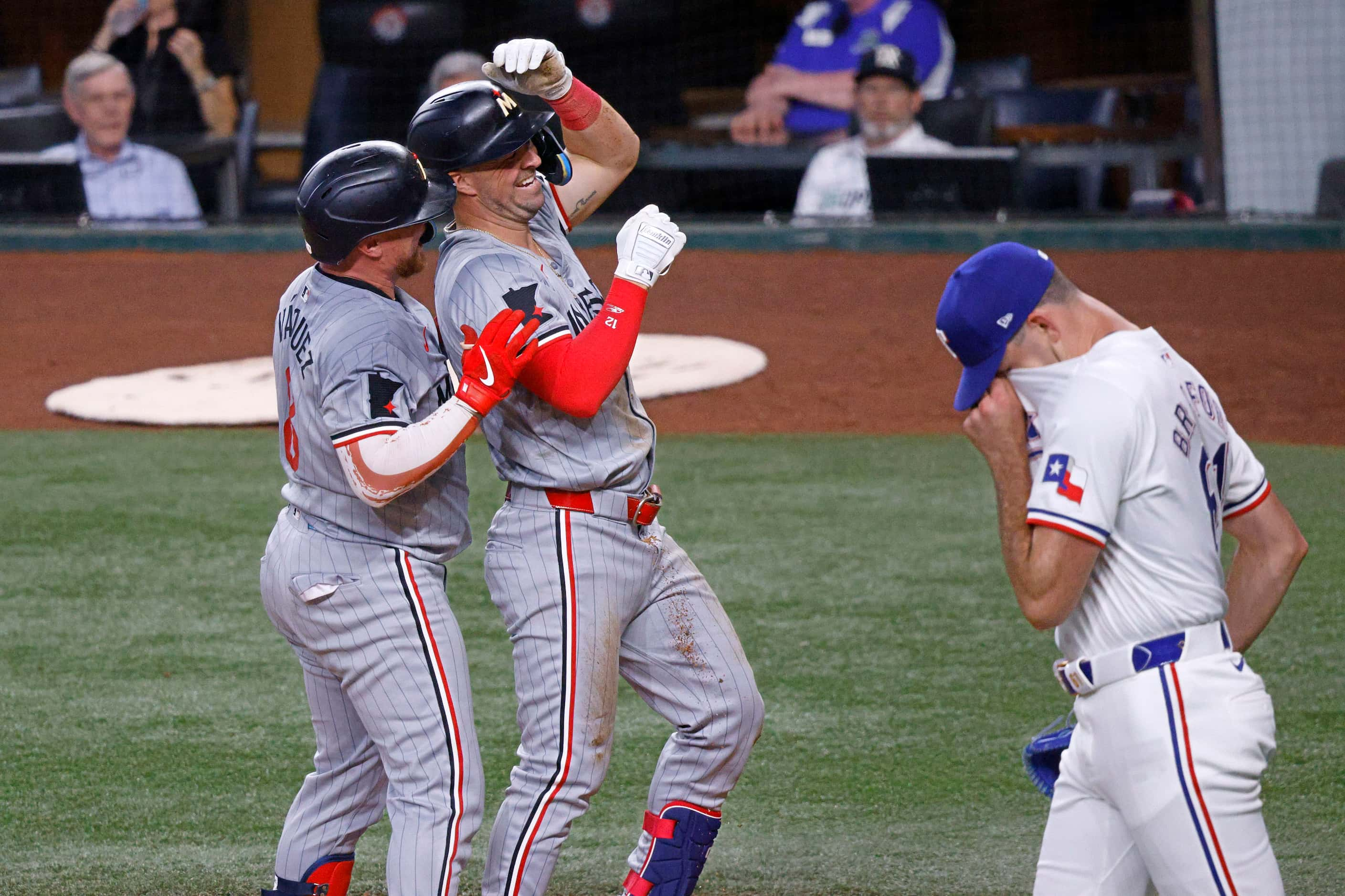 Minnesota Twins second base Kyle Farmer (12), center, celebrates with his teammate Minnesota...