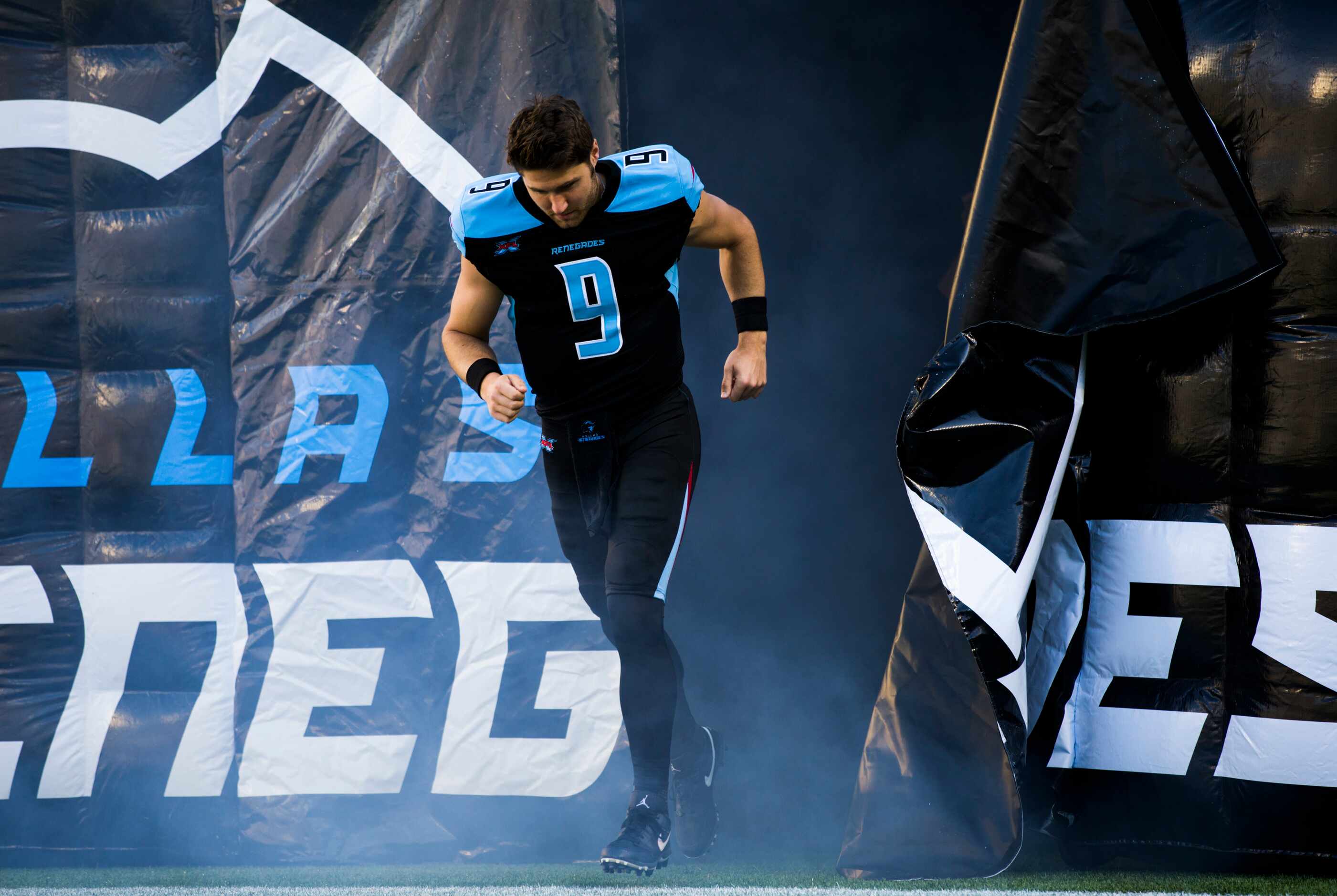 Dallas Renegades quarterback Philip Nelson (9) runs on the field before an XFL game between...