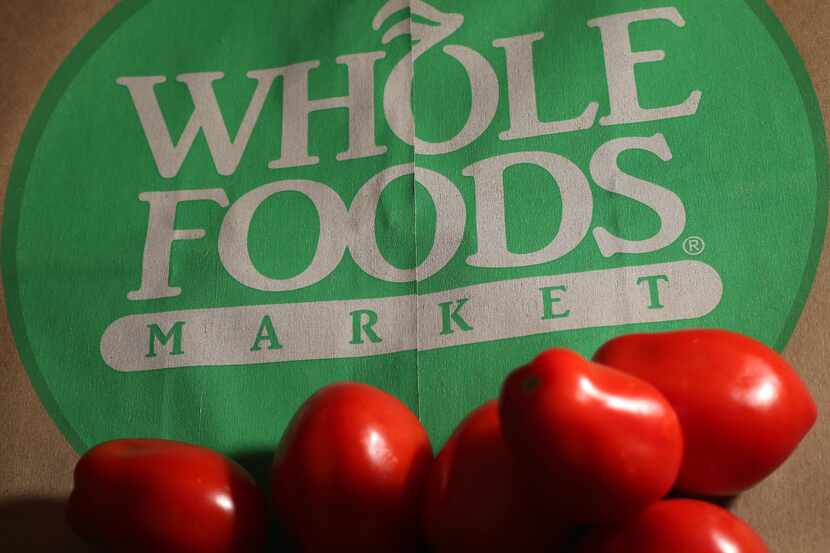 FILE - This July 29, 2013 file photo shows produce on a Whole Foods paper bag in Andover,...
