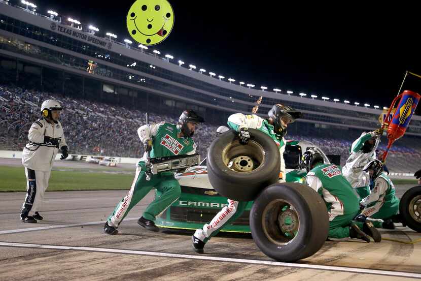 Pit crew members for Kevin Harvick in the #5 Hunt Brothers Pizza Chevrolet during a pit stop...