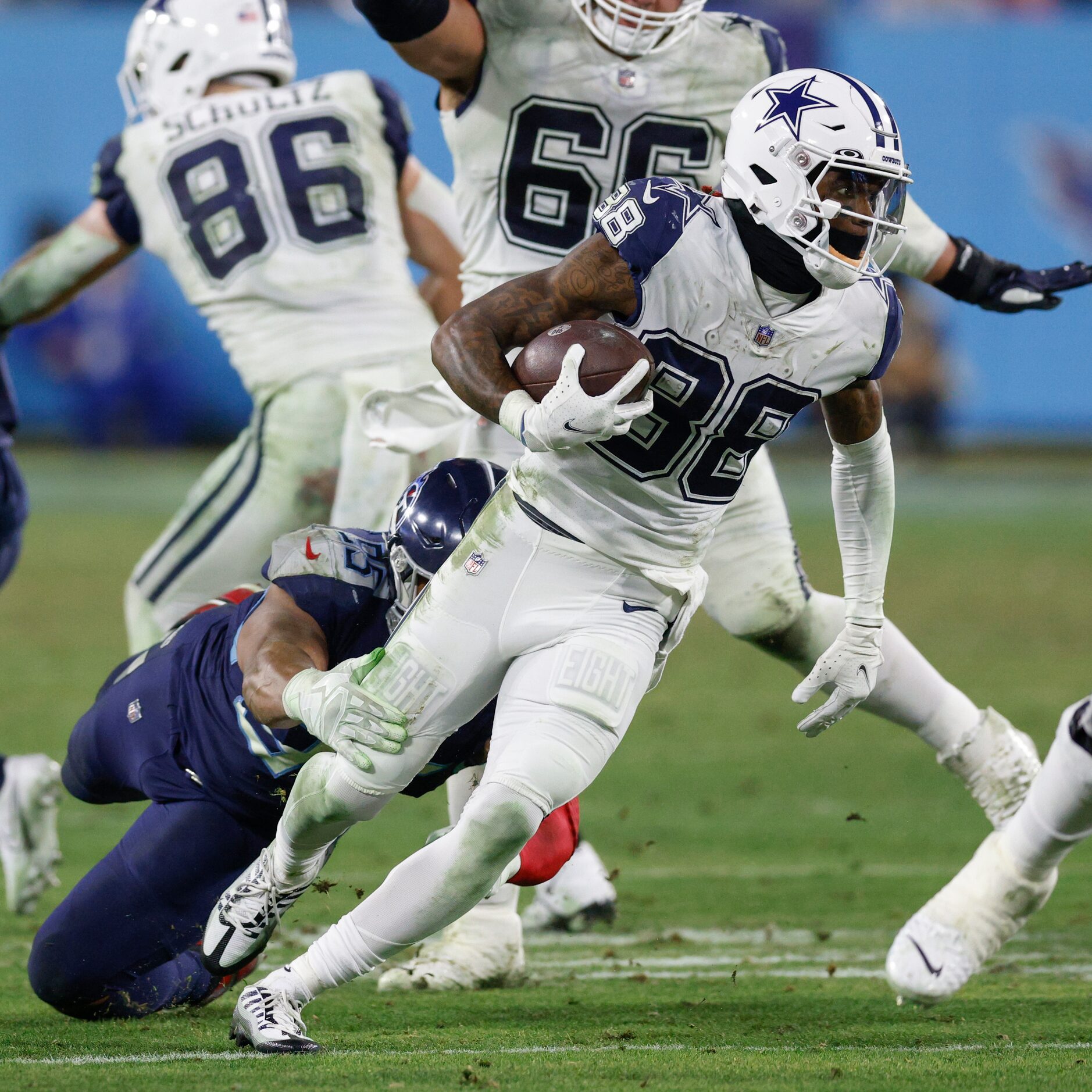 Tennessee Titans defensive end DeMarcus Walker (95) tries to tackle Dallas Cowboys wide...