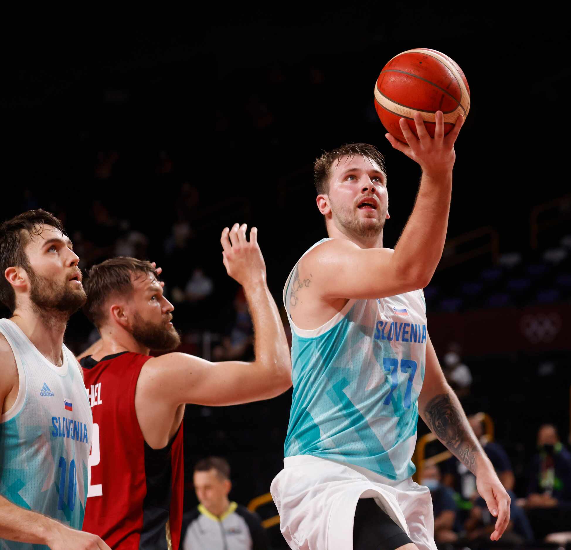 Slovenia’s Luka Doncic (77) attempts a shot after the foul as they play Germany during the...