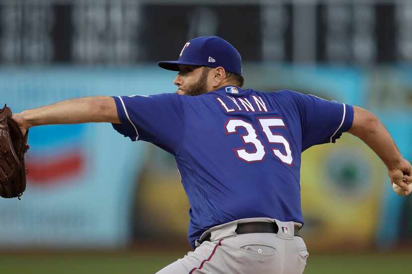 Texas Rangers pitcher Lance Lynn works against the Oakland Athletics in the first inning of...