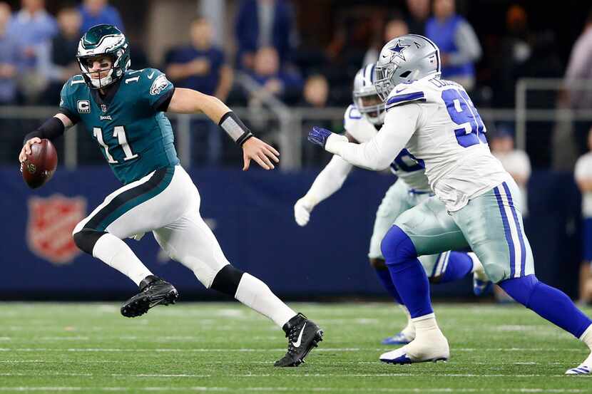 Philadelphia Eagles quarterback Carson Wentz (11) breaks away from Dallas Cowboys defensive...
