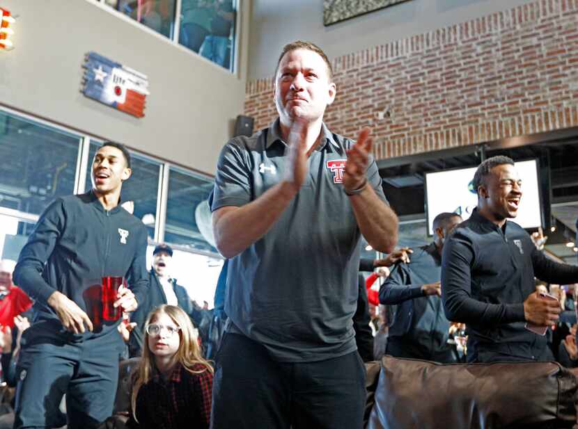 Texas Tech coach Chris Beard celebrates after finding out where the Red Raiders will play...