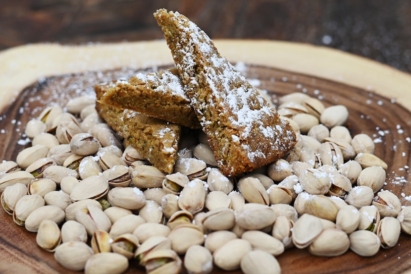 Pistachio Shortbread wedges served on a pile of pistachios