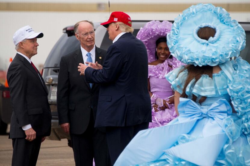 President-elect Donald Trump (center) talked with Alabama Gov. Robert Bentley (second from...