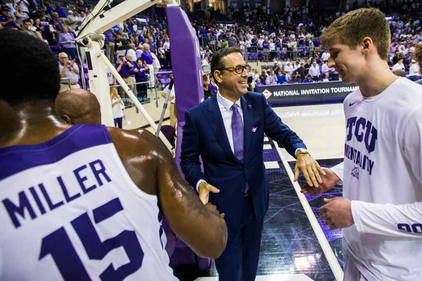 TCU Athletic Director Chris Del Conte congratulates the TCU Horned Frogs after they won an...