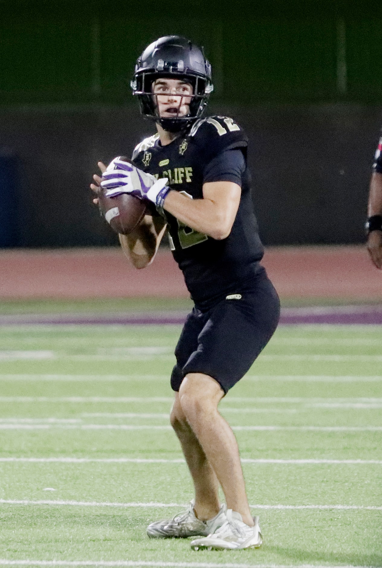 South Oak Cliff High School quarterback Carter Kopecky (12) looks to pass during the first...