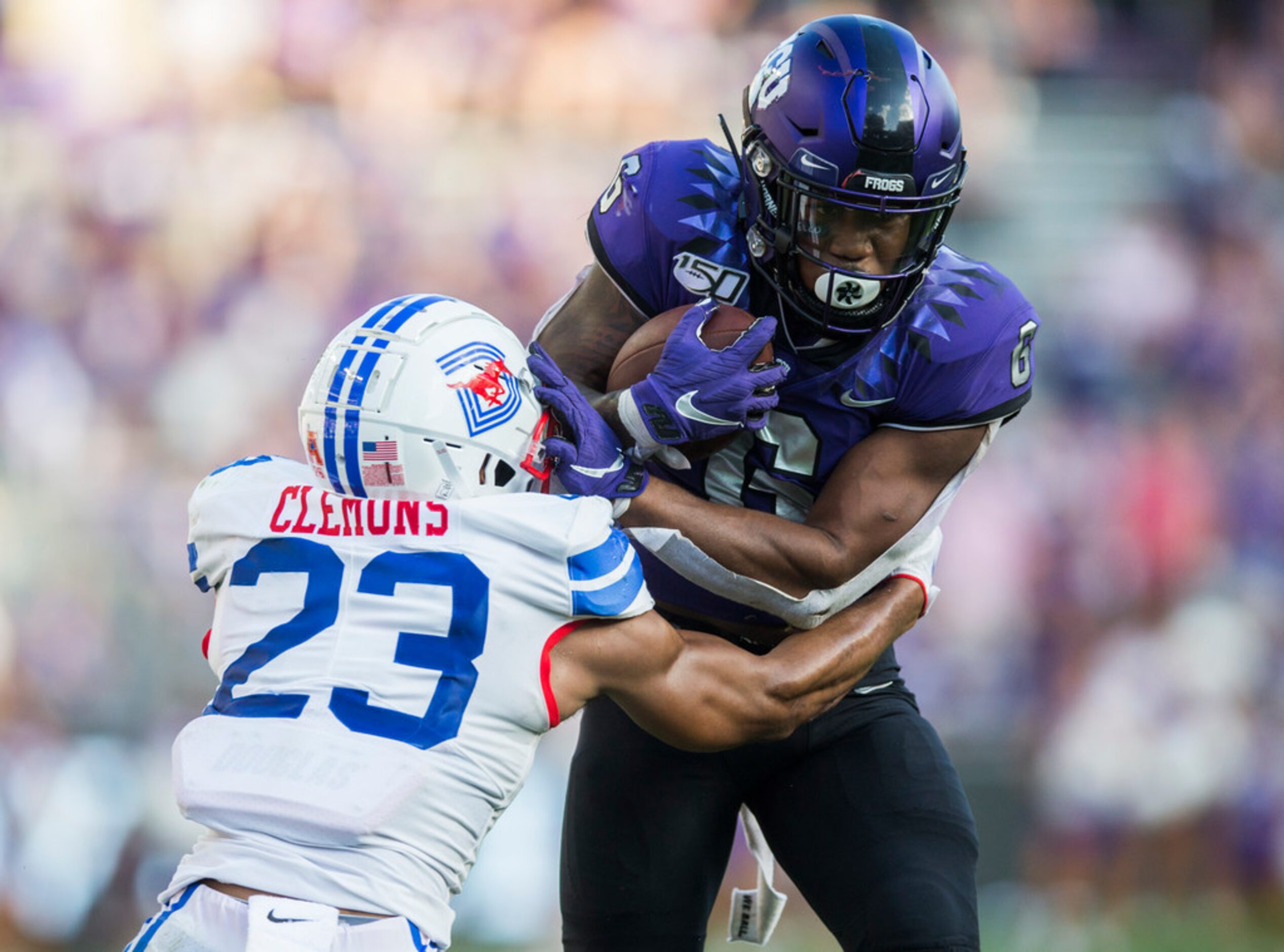 TCU Horned Frogs running back Darius Anderson (6) is tackled by Southern Methodist Mustangs...