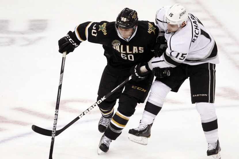 Dallas Stars left wing Antoine Roussel (60) fights for position with Los Angeles Kings...