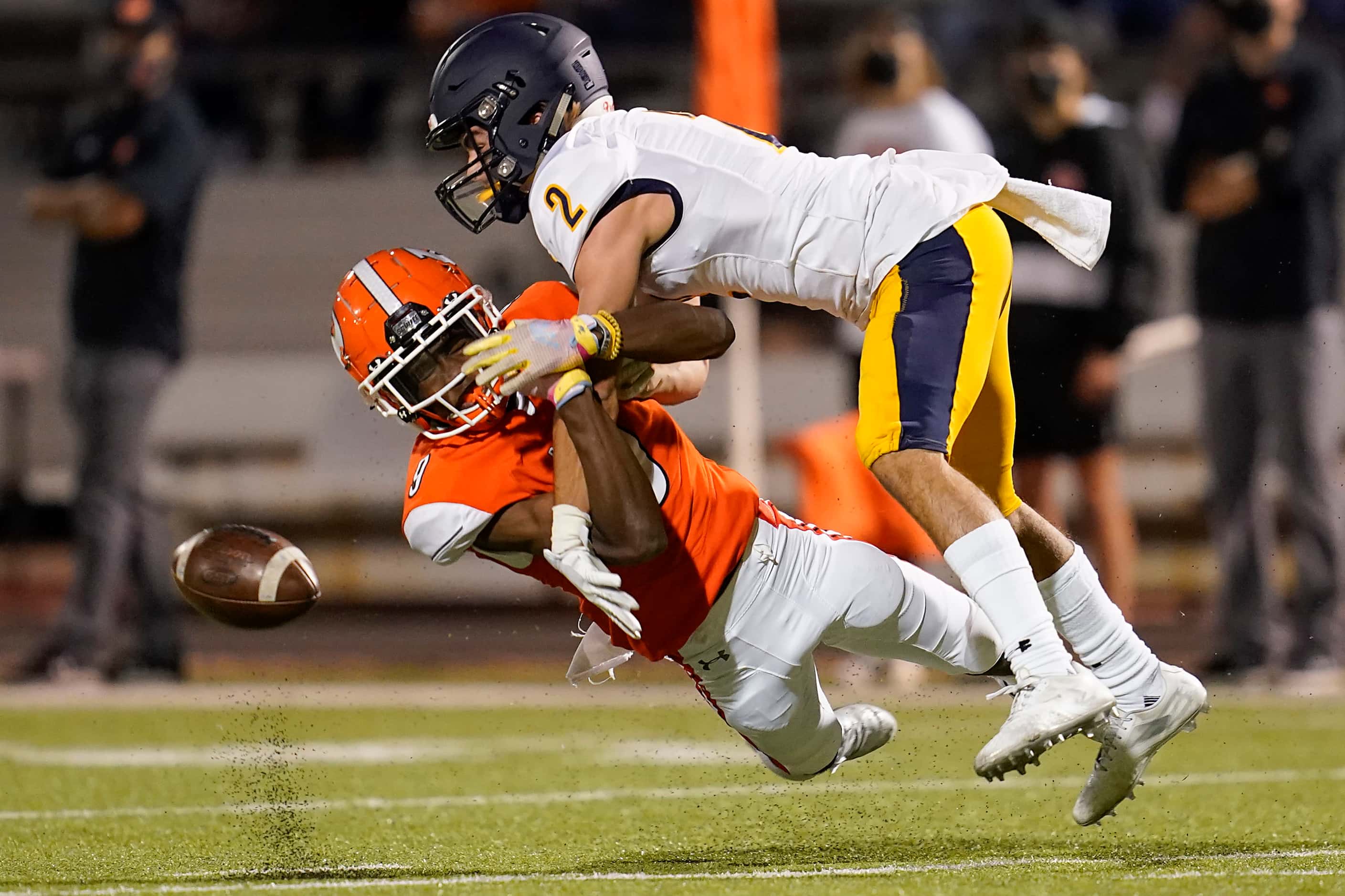 Rockwall defensive back Dariel Brown (9) breaks up a pass intended for Highland Park wide...