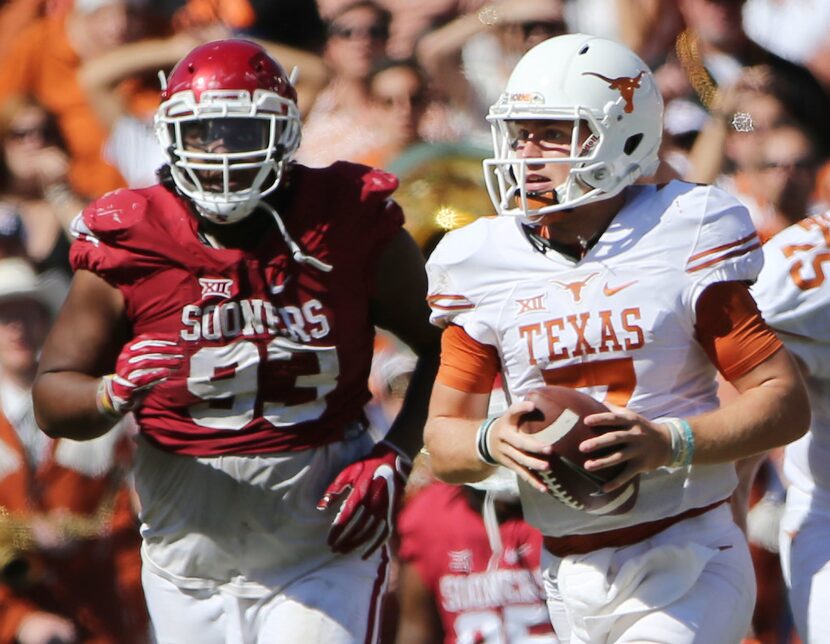 Texas Longhorns quarterback Shane Buechele (7) runs with the ball in the second half during...