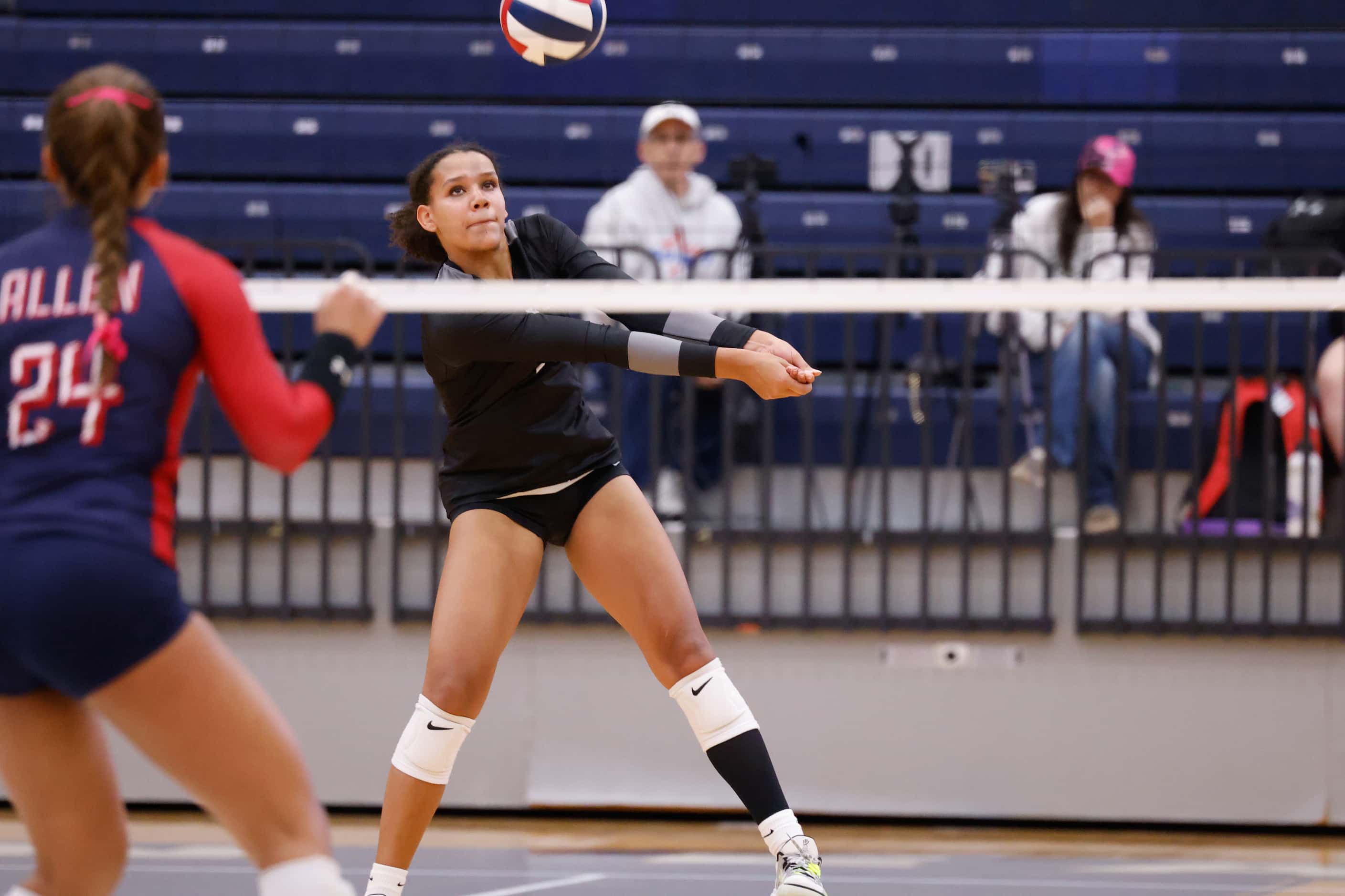 Denton Guyer senior Kyndal Stowers (5) volleys the ball after a serve from Allen in the...