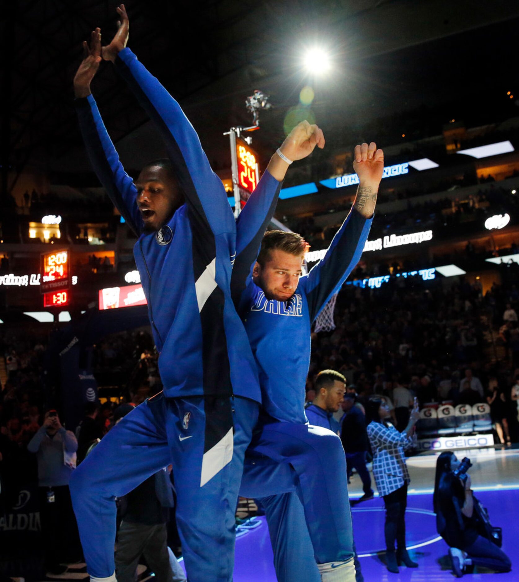 Dallas Mavericks forwards Luka Doncic (right) and Dorian Finney-Smith (left) body bump...