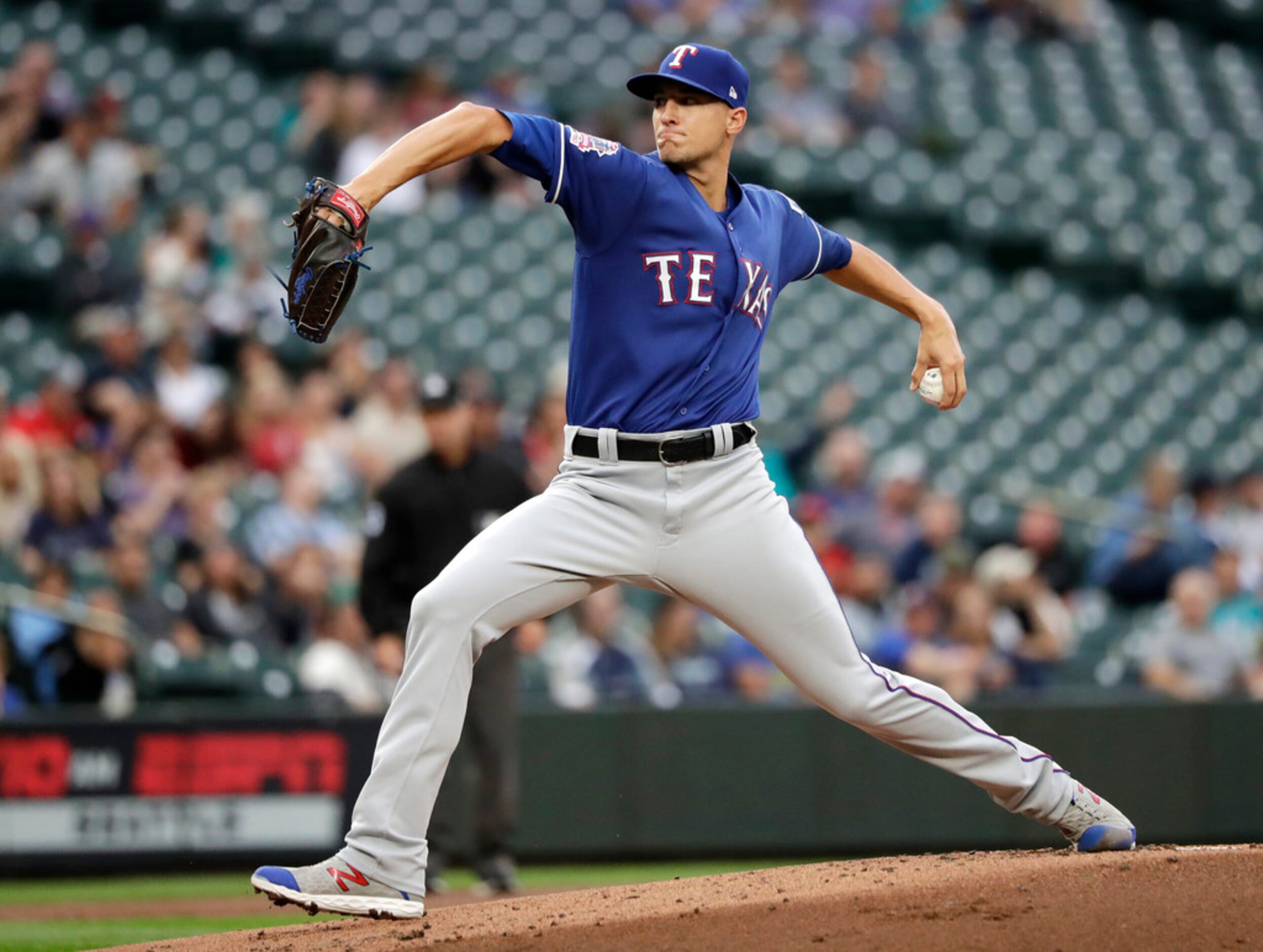 Texas Rangers starting pitcher Brett Martin throws against the Seattle Mariners in the first...