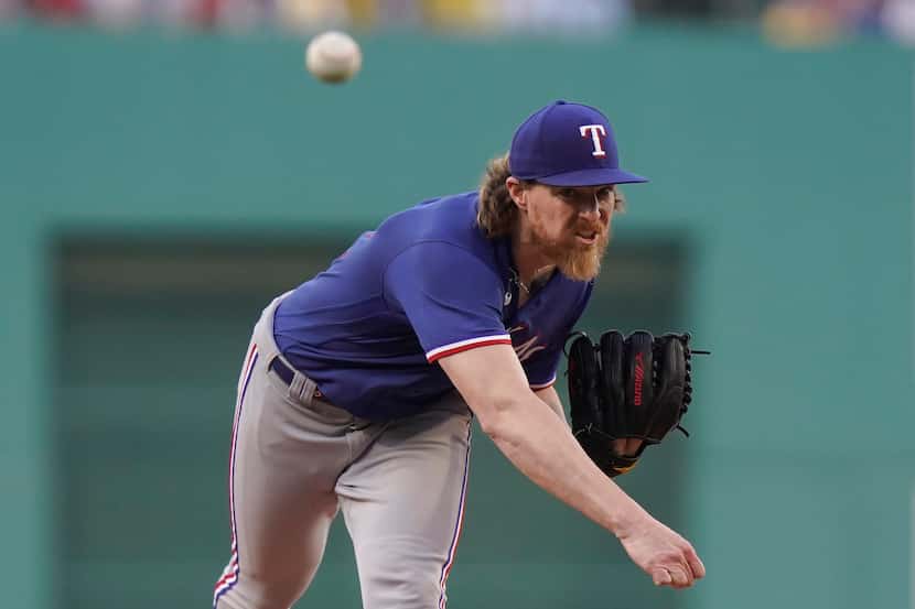 Texas Rangers' Jon Gray delivers a pitch to a Boston Red Sox batter in the first inning of a...