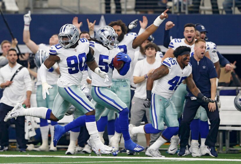 Dallas Cowboys defensive end Demarcus Lawrence (90) looks to block as Dallas Cowboys middle...