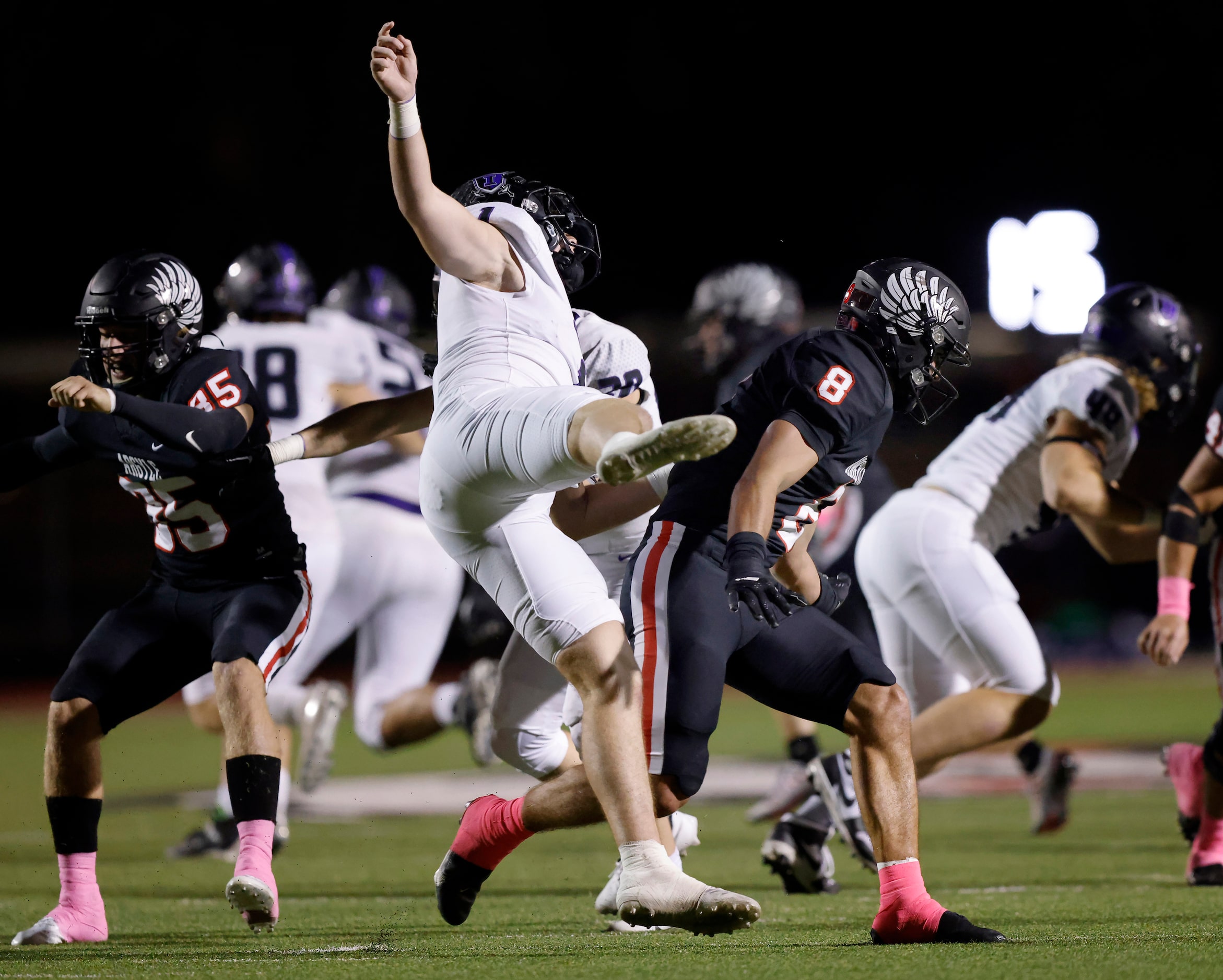 Frisco Independence kicker Matthew Goldman (1) is spun around by Argyle linebacker Devon...