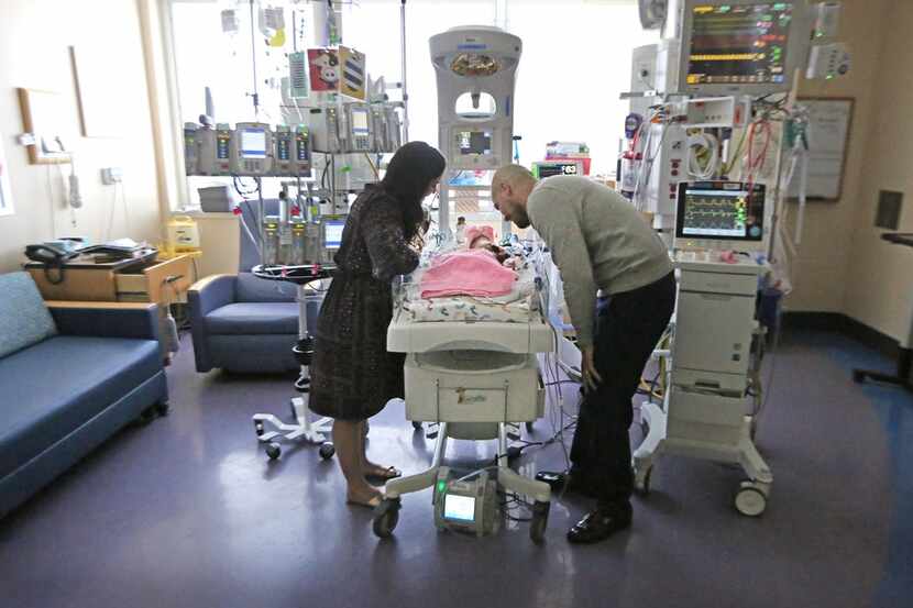 Dallas ISD trustee Miguel Solis and his wife, Jacqueline, watched over baby Olivia on...
