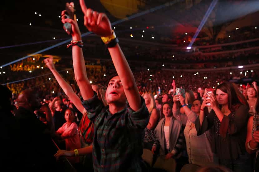 Fans for One Direction cheer their stars as they perform at KISS-FM's annual Jingle Ball...