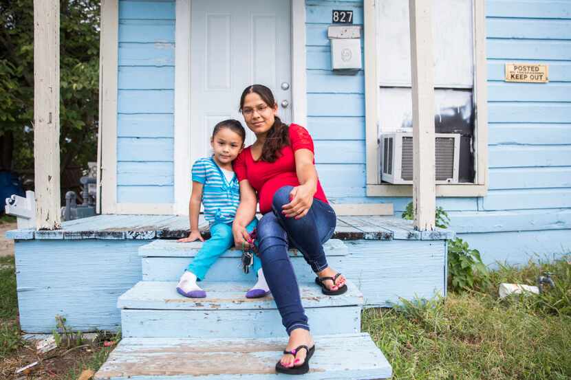 Joanna Pena poses with 4-year-old daughter Zaory Rendon on the steps of her rental house in...