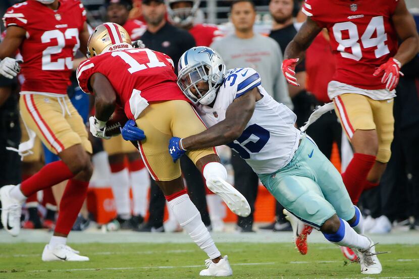 Dallas Cowboys defensive back Kavon Frazier (35) tackles San Francisco 49ers punt returner...