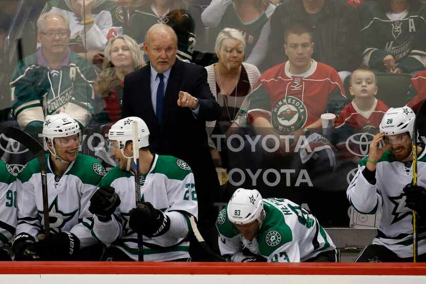 Dallas Stars head coach Lindy Ruff gestures to his players during the second period of Game...