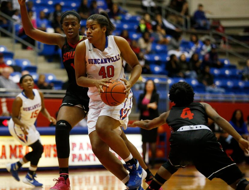 Duncanville Pantherettes forward Ciera Johnson (40) drives the ball past South Grand Prairie...