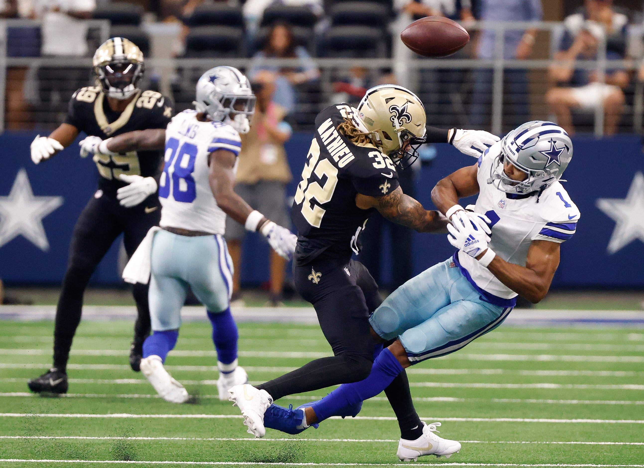 Dallas Cowboys wide receiver Jalen Tolbert (1) can’t hang onto a pass as he’s popped by New...