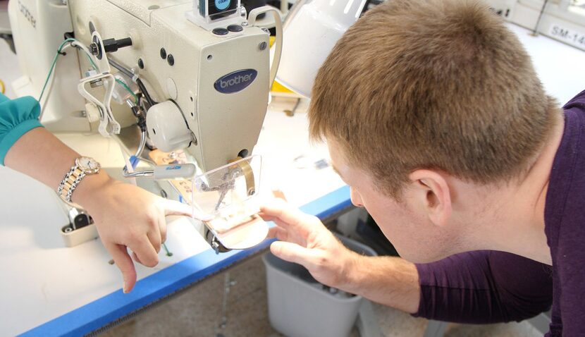 Bryan Manning is shown the sewing blind-friendly sewing machines machine at the Dallas...