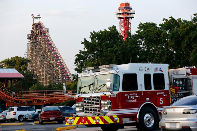 Rescue teams went to the scene at Six Flags Over Texas after a woman fell from the Texas...