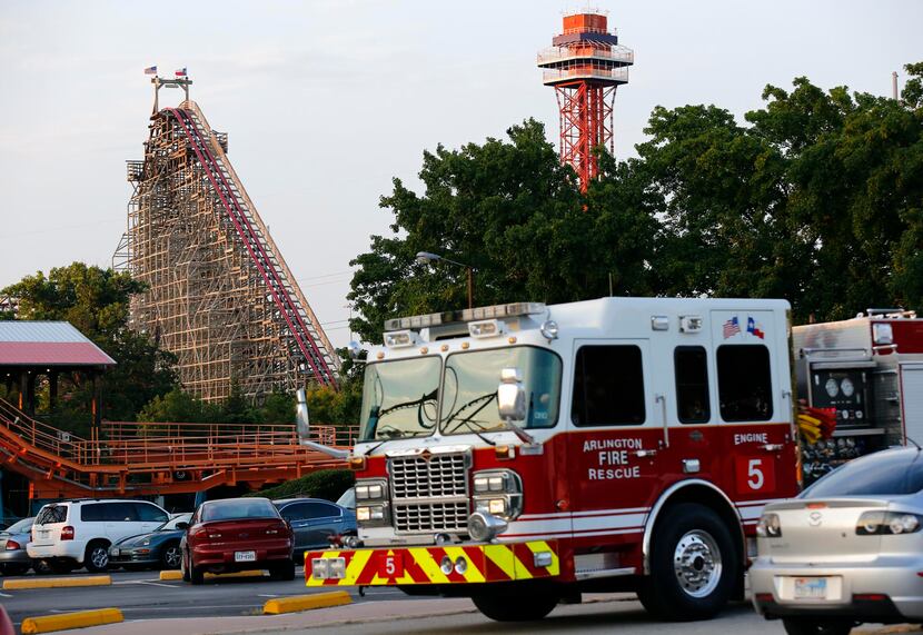 Rescue teams went to the scene at Six Flags Over Texas after a woman fell from the Texas...