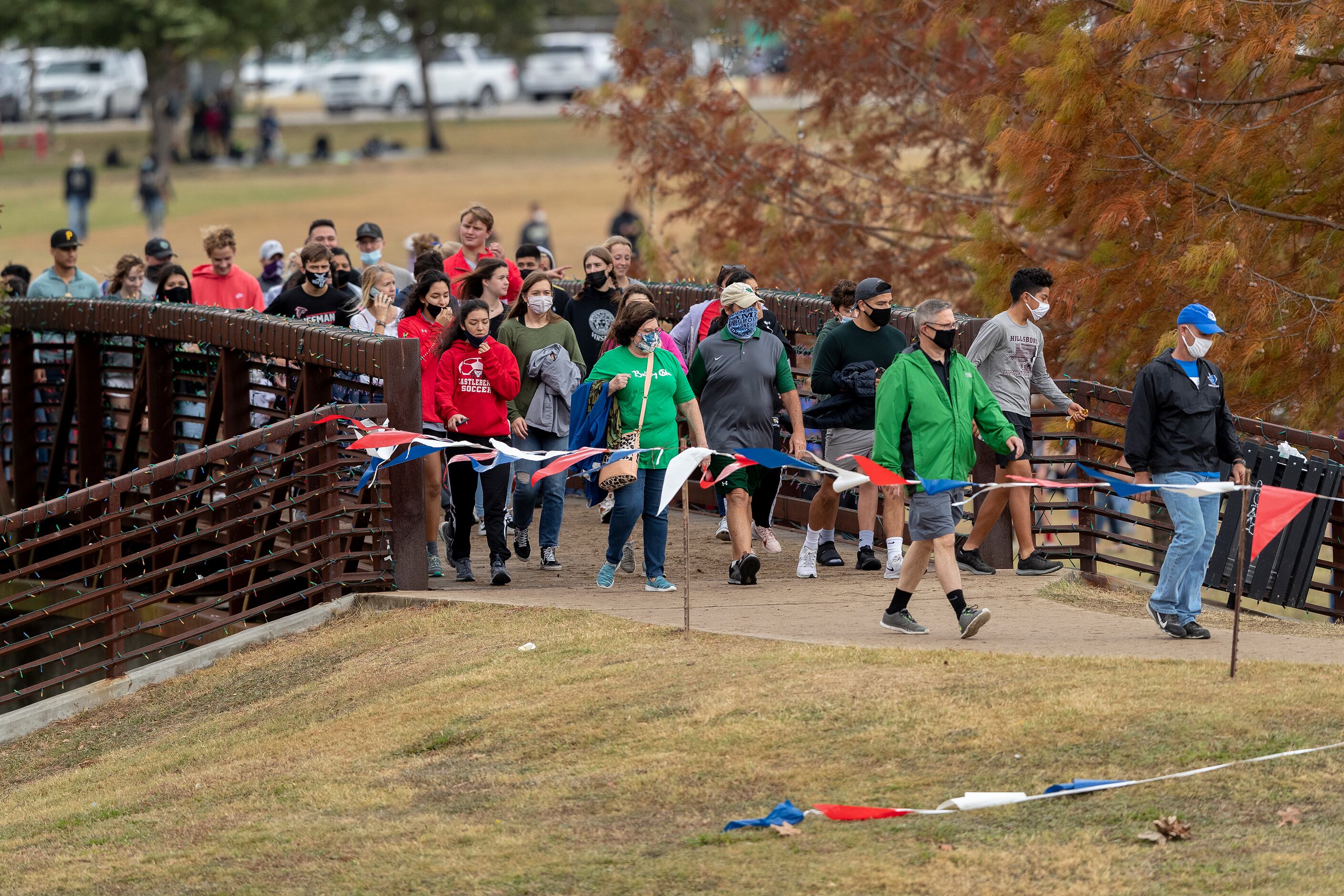Spectators move through the race course looking for a spot to watch the boys UIL Class 4A...