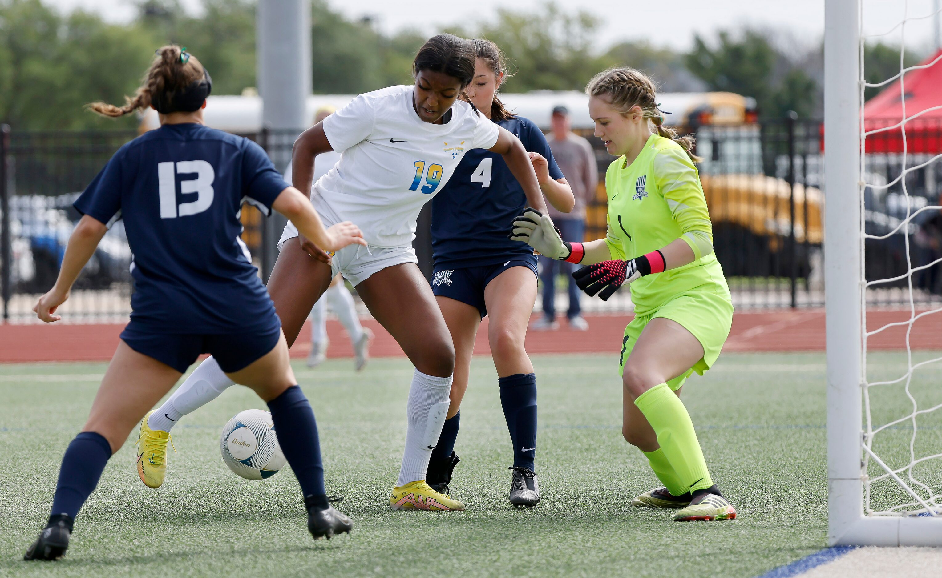 Frisco forward Kori Ballard (19) shoots and scores on Frisco Reedy goalkeeper Kennedy...