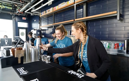 Lauren Gilmore (left), 23,  of Allen, and Morgan Baker, 25, of McKinney, train as bartenders...