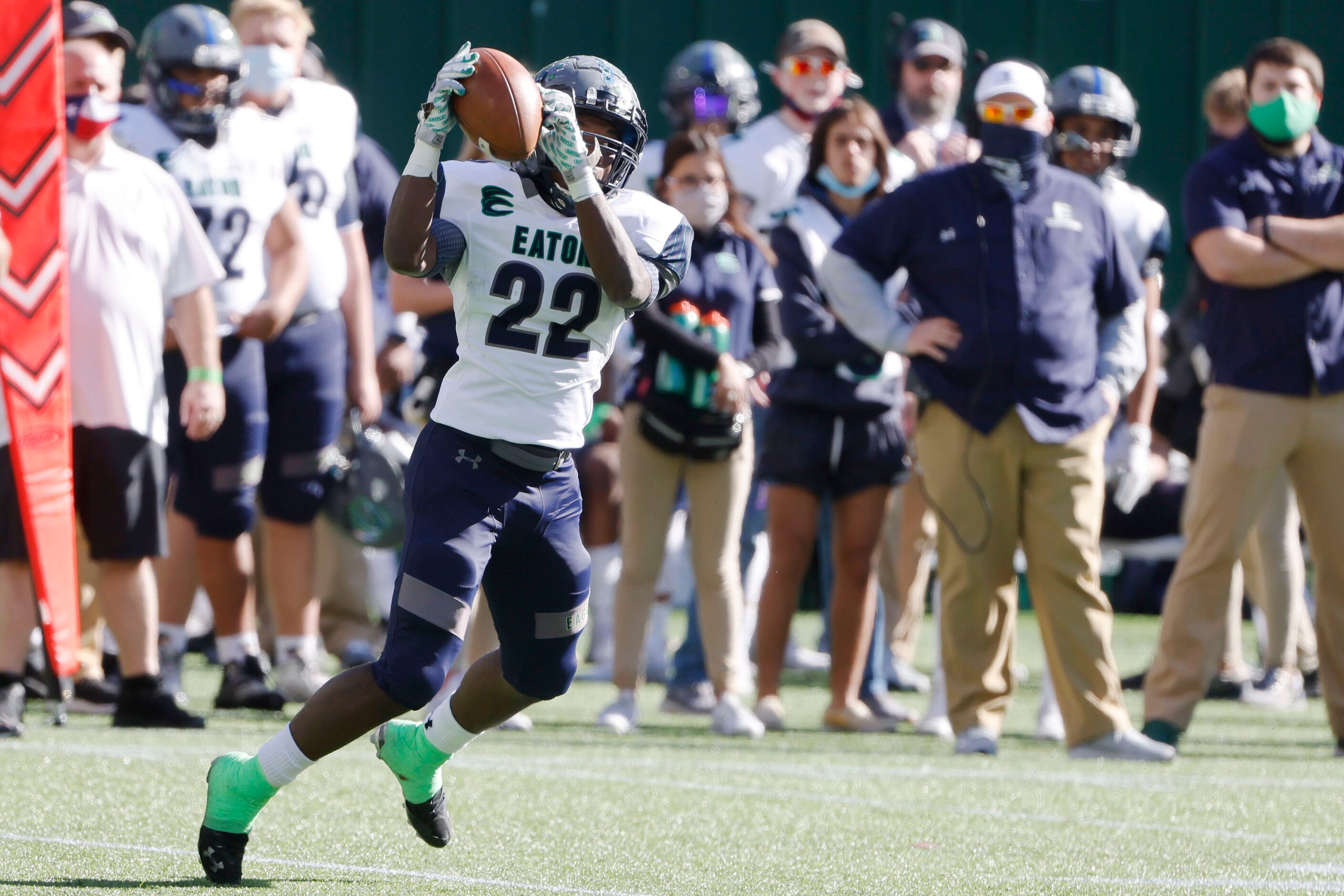 Northwest Eaton’s Jahbez Haskings (22), catches a short pass and converts it into a long...