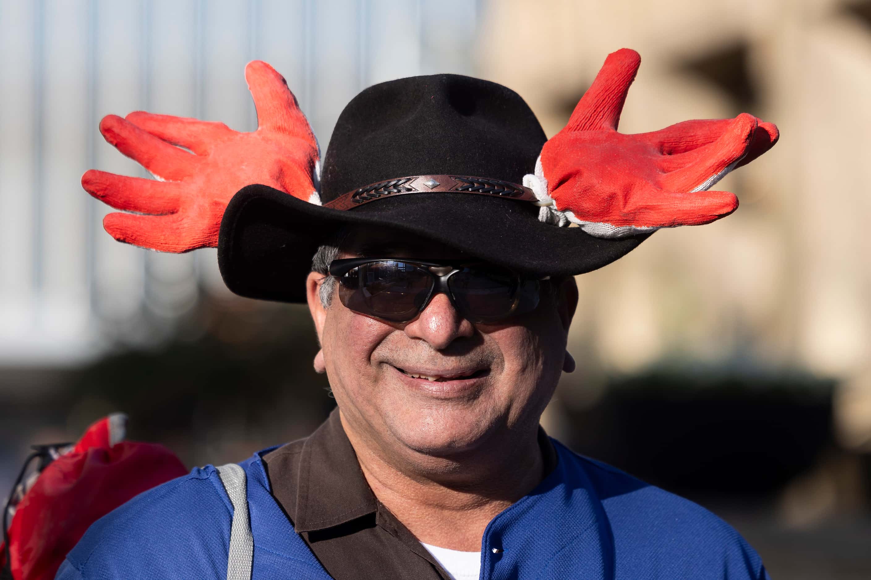 Mario Montoya from Fort Worth and season ticket holder since 1990 wears antlers alluding to...