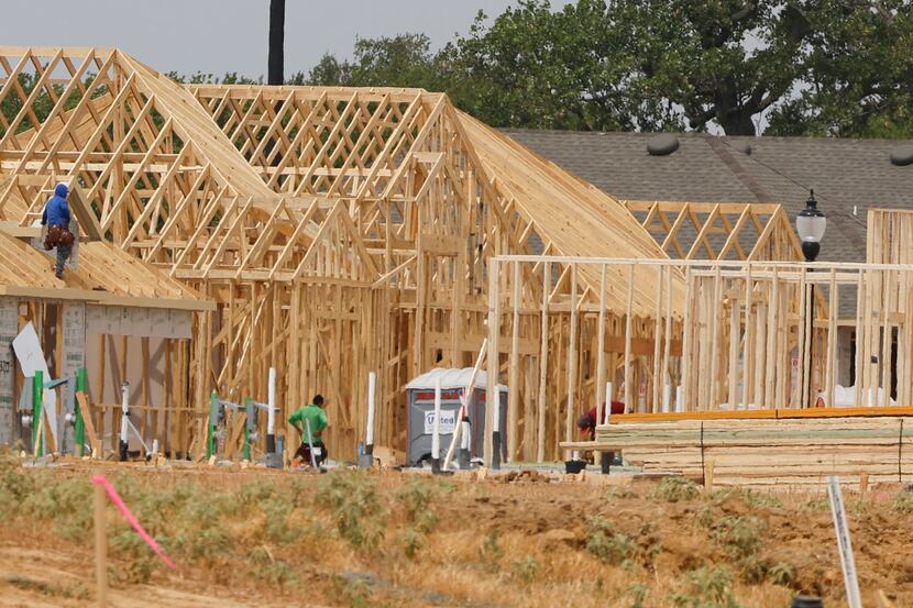 Workers remain on an under construction site of Silverado community on Wednesday, July 20,...