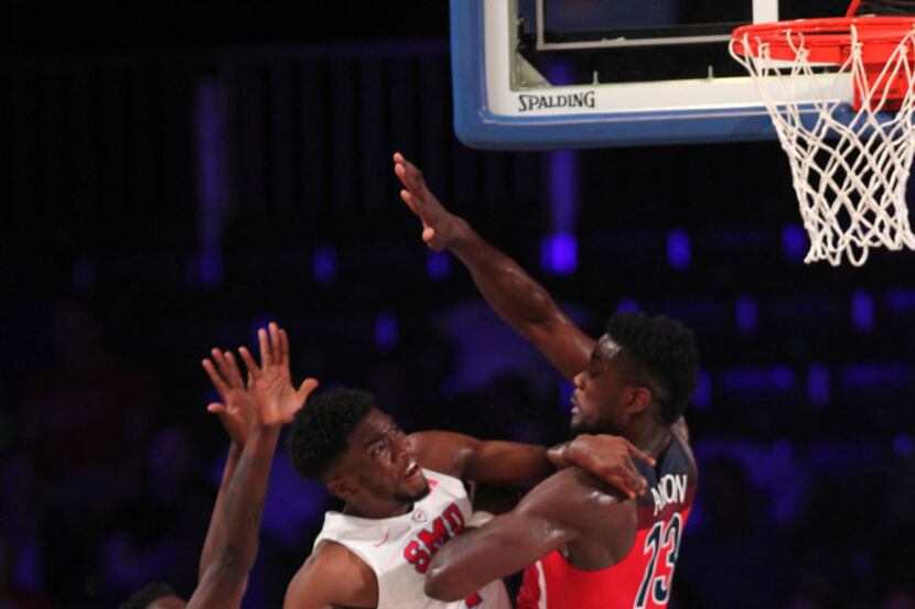 SMU guard Shake Milton (1) drives to the basket while guarded by Arizona forward Deandre...