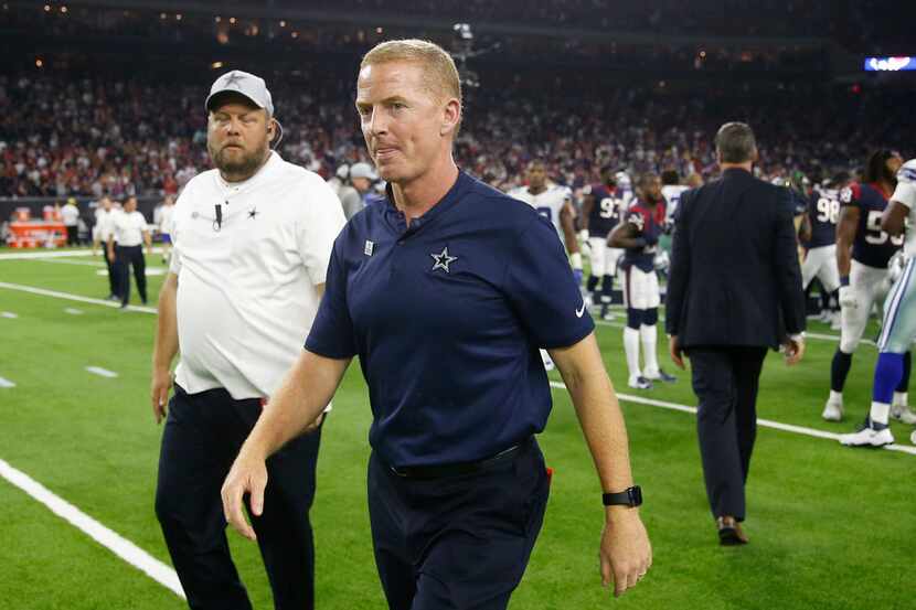Dallas Cowboys head coach Jason Garrett walks off the field after overtime play at NRG...