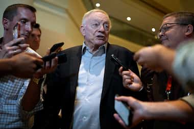 Dallas Cowboys owner Jerry Jones responds to reporters' questions after the NFL football...