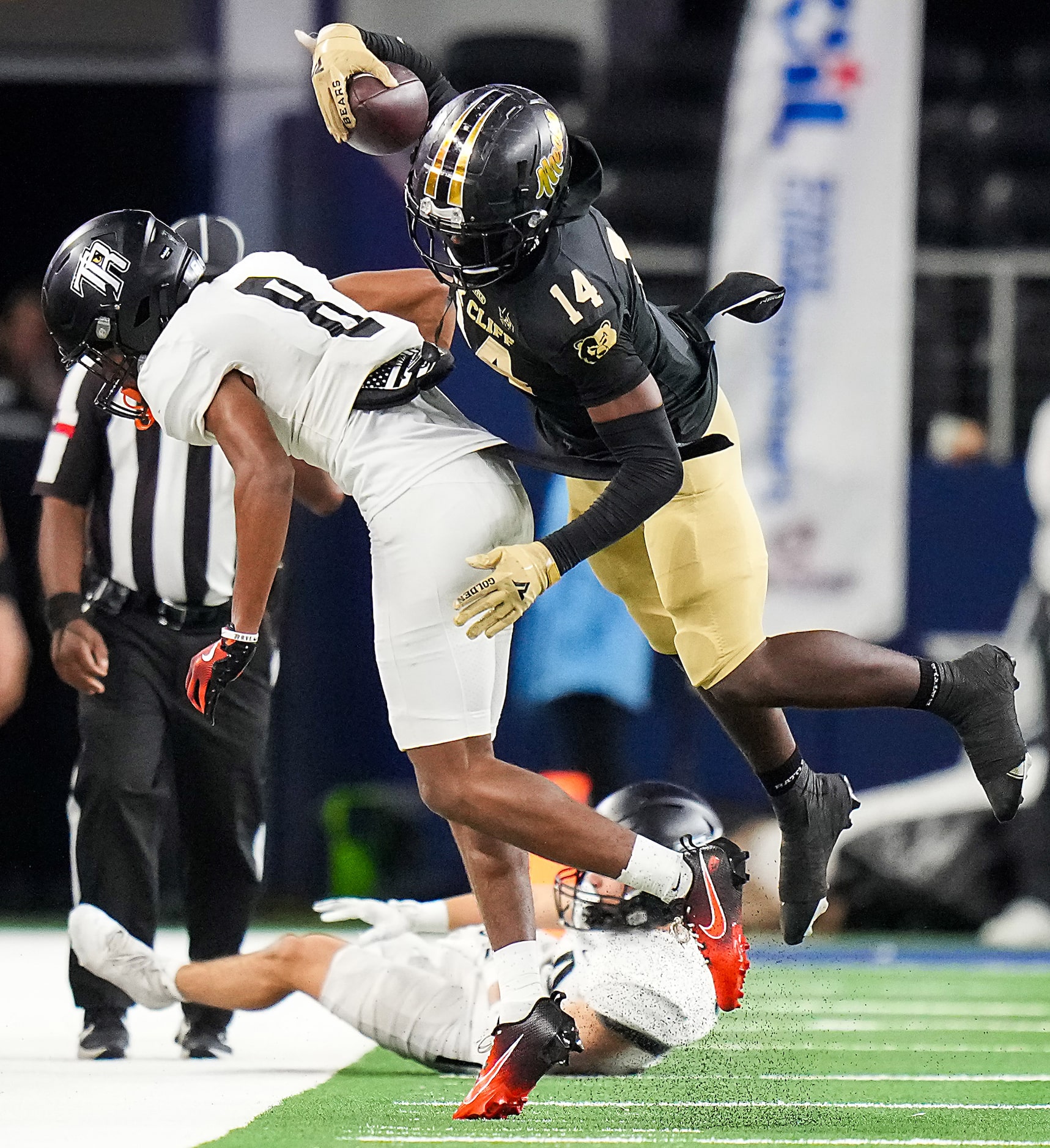 South Oak Cliff wide receiver Nate Coleman (14) is knocked out of bounds by Richmond Randle...