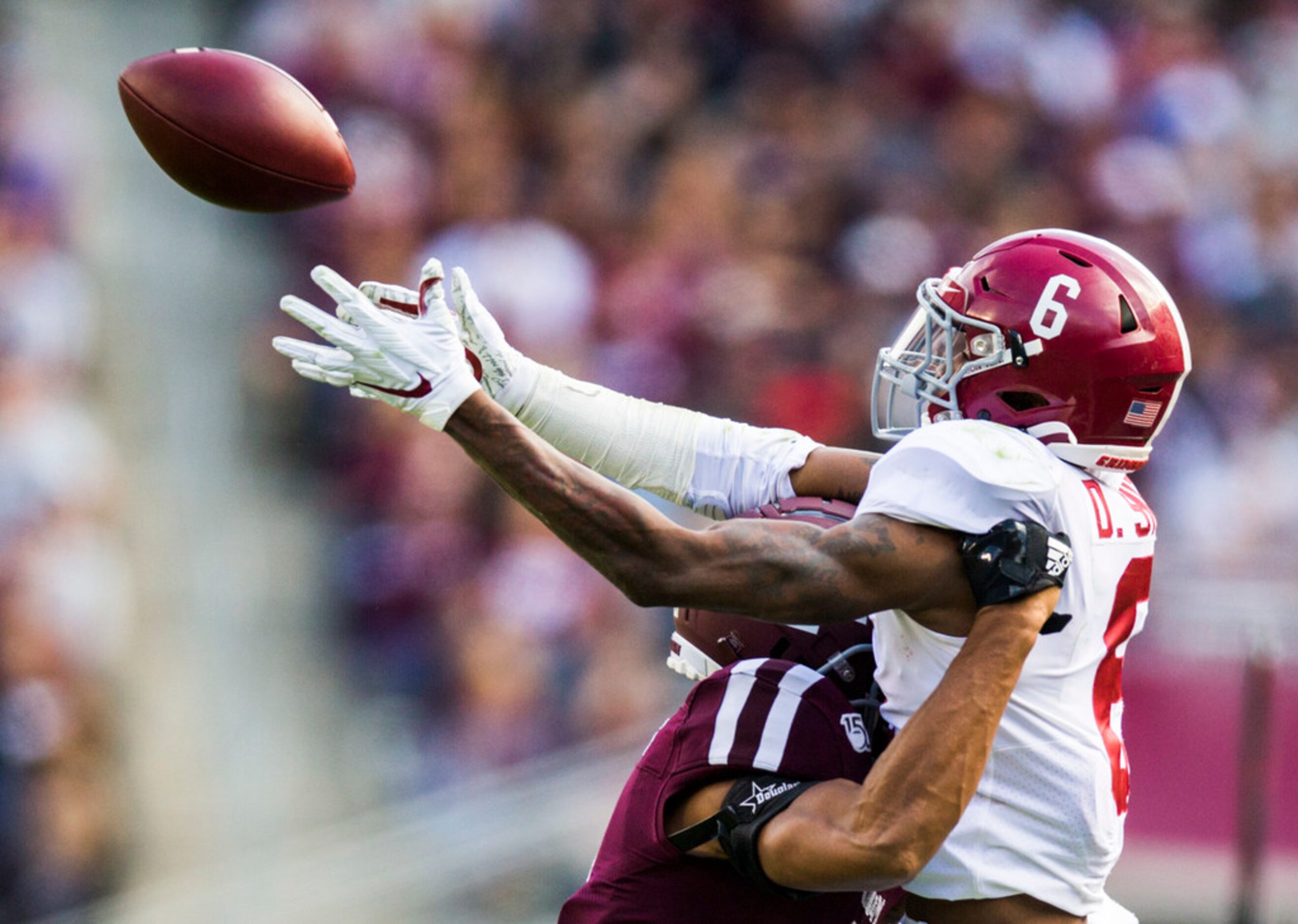 Texas A&M Aggies defensive back Elijah Blades (2) prevents a catch by Alabama Crimson Tide...