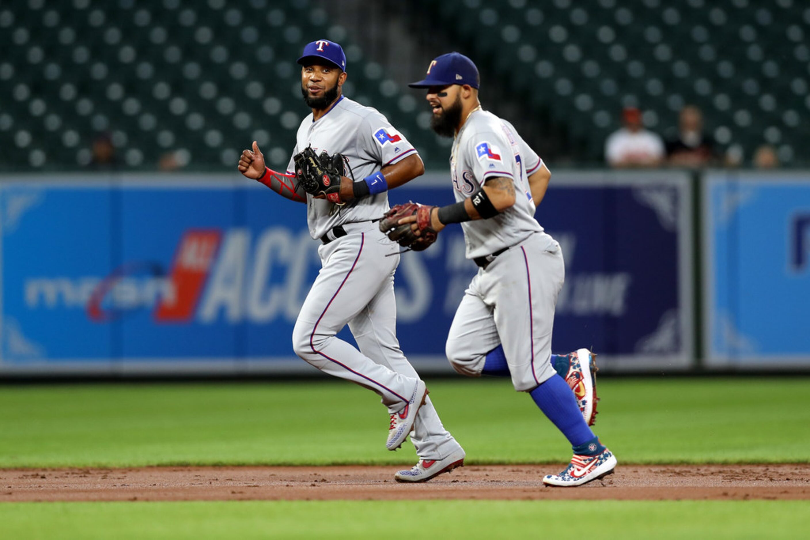 BALTIMORE, MARYLAND - SEPTEMBER 05: Elvis Andrus #1 (L) and Rougned Odor #12 of the Texas...