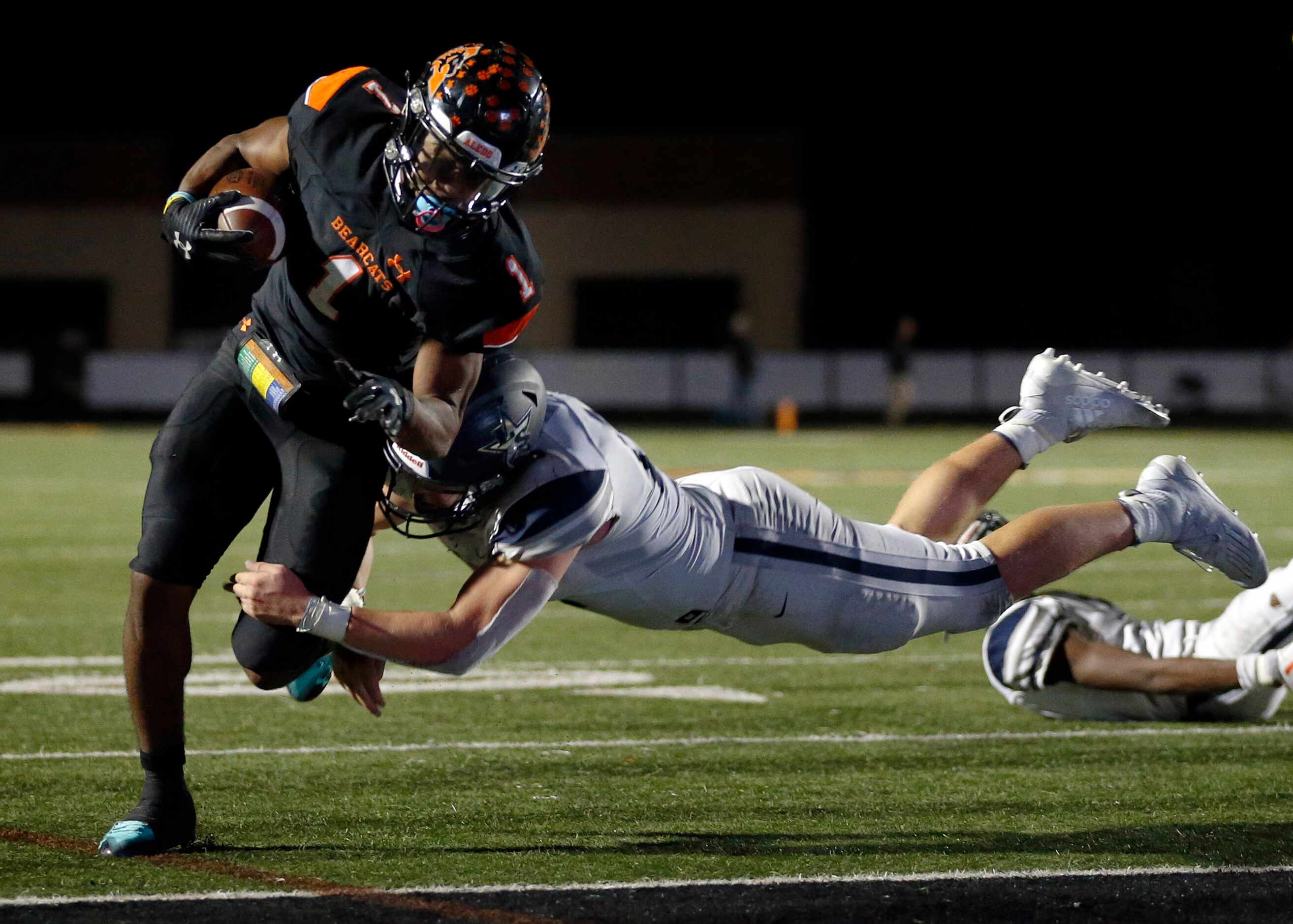 Frisco Lone Star linebacker Blake Gotcher (12) makes a diving tackle attempt of Aledo...