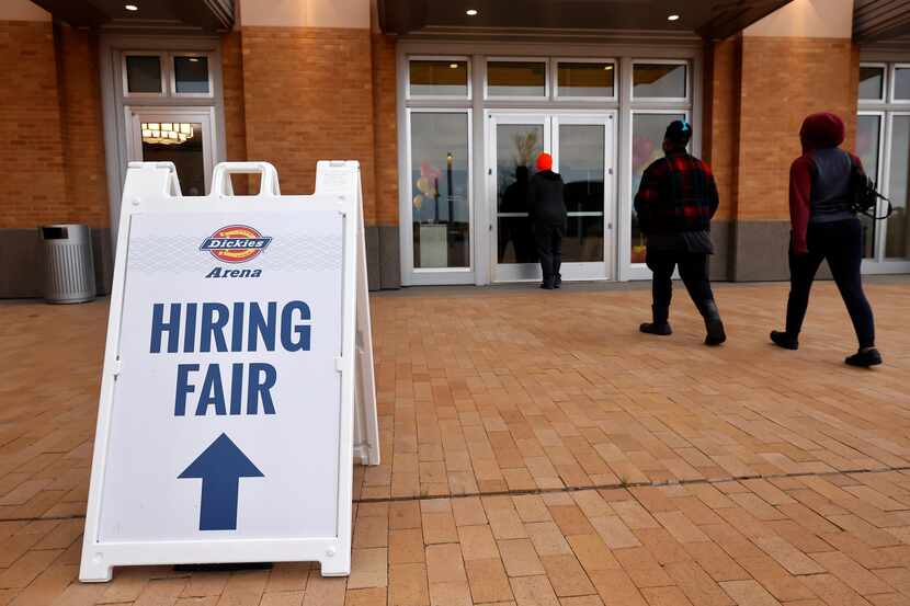 People arrive for a Dickies Arena job fair where unemployed Texans can apply for positions...