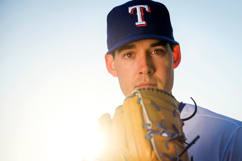 Texas Rangers pitcher Luke Farrell poses for a photograph during spring training photo day...